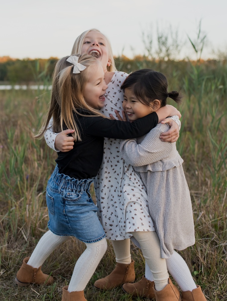 Three sisters hugging